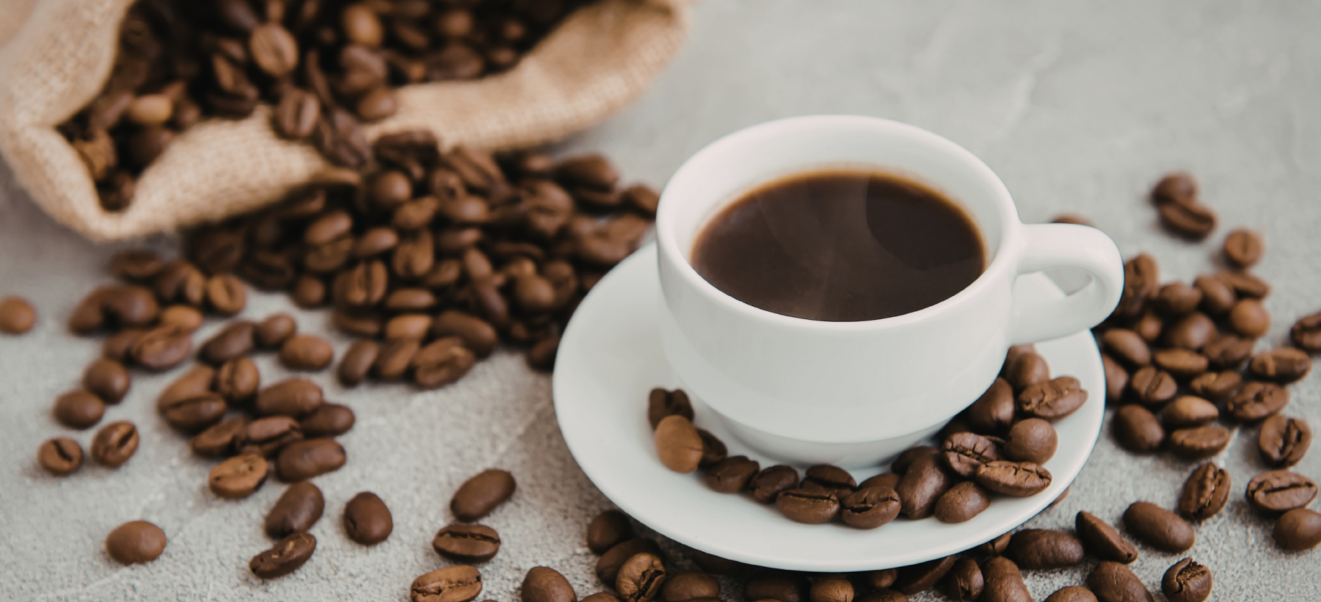 Freshly brewed black coffee with beans